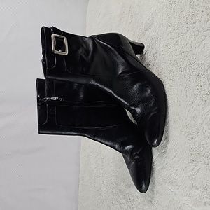 Cole Haan black leather heeled boots.